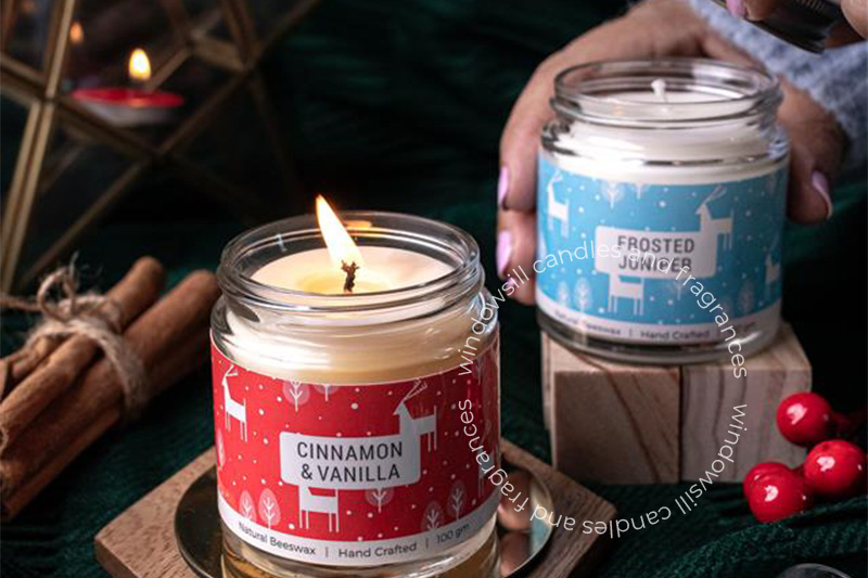 Cozy winter home decor with candles and seasonal elements like pinecones and eucalyptus.